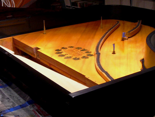 A piano with soundboard crack repaired showing a nice crown.